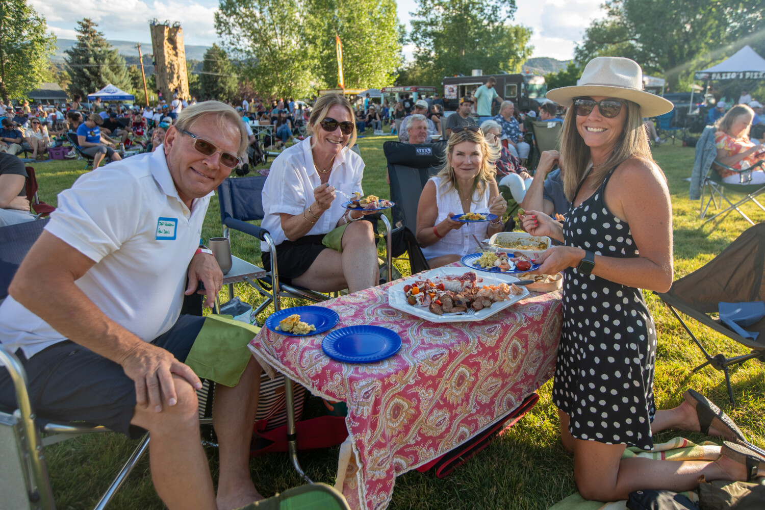 Adult family of multi-ages people enjoying a picnic at Town of Eagle ShowDown Town Presented by Alpine Bank