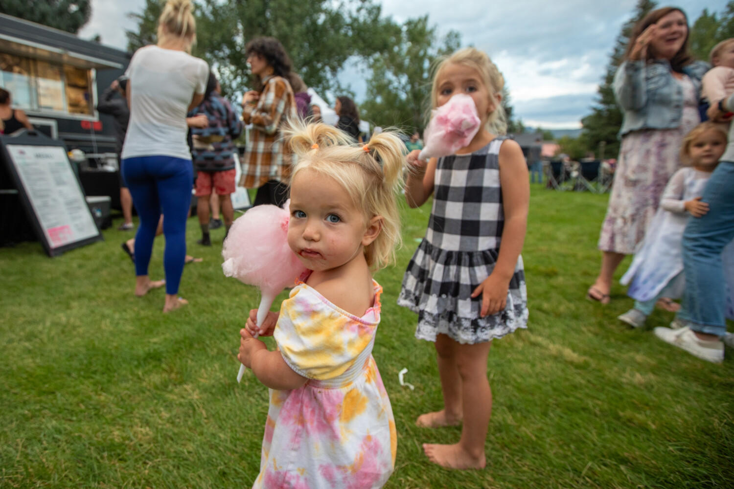 Children enjoying cotton candy