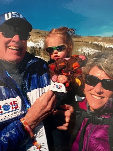 Caroline Fisher, Bob Knous and grandkid smile on the ski hill